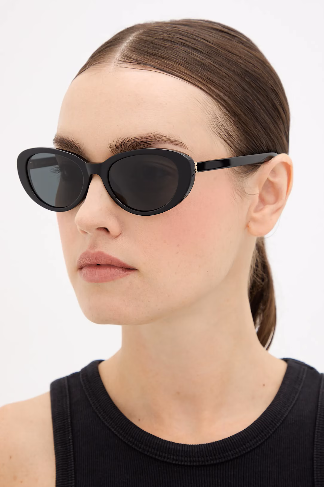 Woman in Saint Laurent sunglasses